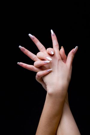Beautiful woman hand with manicure, over black backgroundの写真素材