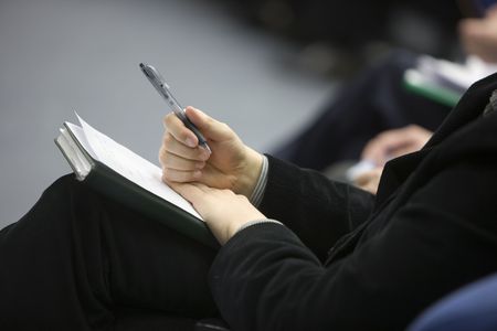 Hands of businessman with notebook on soft backgroundの写真素材