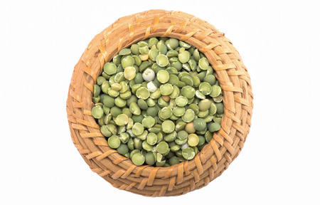 Green peas in a basket on a white background. Isolatedの写真素材