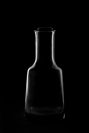 elegant  silhouette of the bottle on a black backgroundの写真素材