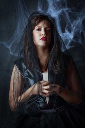 portrait of a beautiful gothic girl in a black veilの写真素材