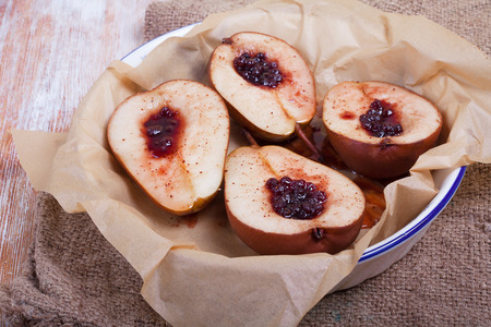 dessert of sweet duchess pears baked in caramel and jamの写真素材