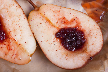 dessert of sweet duchess pears baked in caramel and jamの写真素材