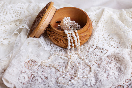 strands freshwater pearls fell from the box on lace fabricの写真素材