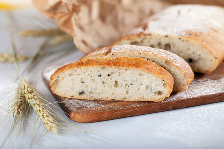 sliced fresh white bread with spices and browned crust, soft focusの写真素材