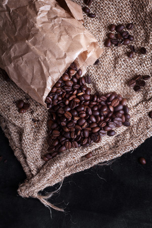 coffee beans woke up from a package in the form of heartの写真素材
