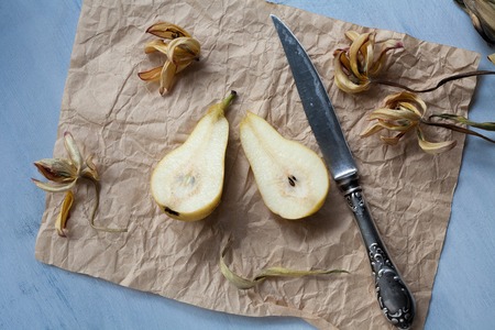 Fresh ripe yellow pears on crafted paperの写真素材