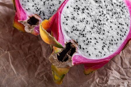 cut fresh pitahaya on a craft paperの写真素材