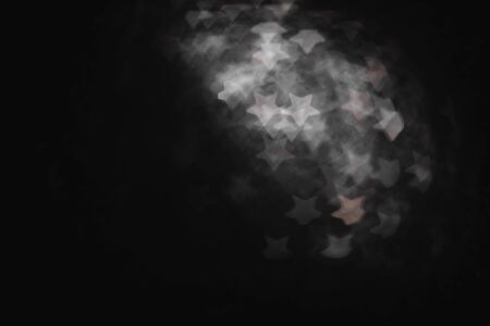 Monochrome vintage abstract background with bokeh defocused lights star shapeの写真素材