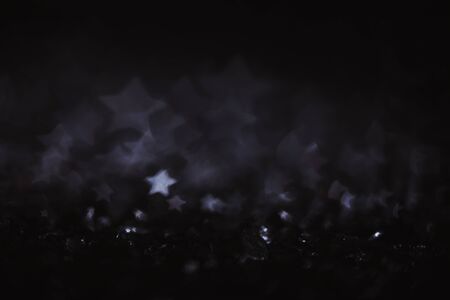 Monochrome vintage abstract background with bokeh defocused lights. Star shape