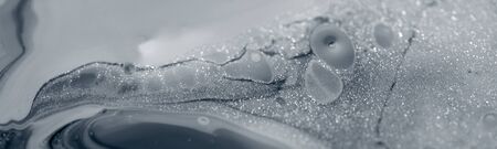 Beautiful abstract silver background with streaks and stains. Banner formatの写真素材