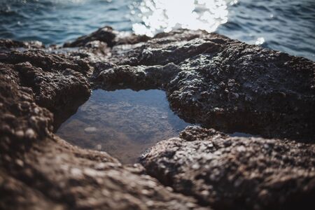 A puddle in the stone after the surf. Croatiaの写真素材