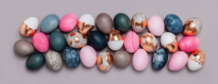 Pattern of pink and blue eggs on a gray background.