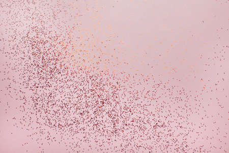 Coral abstract background with small red glitter