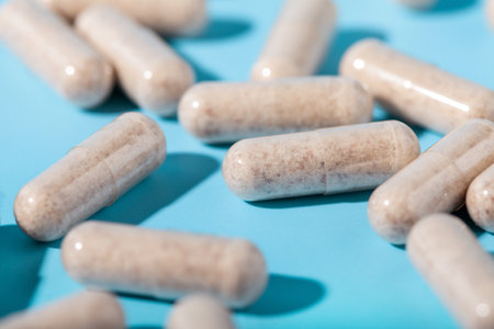 Vegetarian multivitamin capsules on a blue background. Food supplement, multivitamins, medicines, dietary fiber close upの写真素材