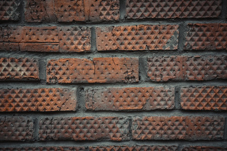 Old brick wall close up. Rhombus patterned brick.の写真素材