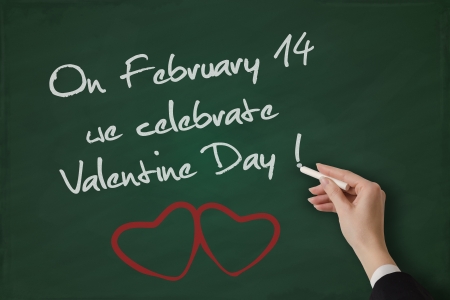 Valentine Day greeting handwritten on a blackboardの写真素材