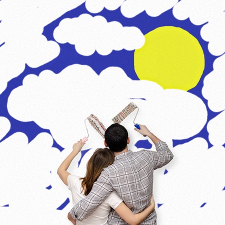 Young couple painting the futureの写真素材