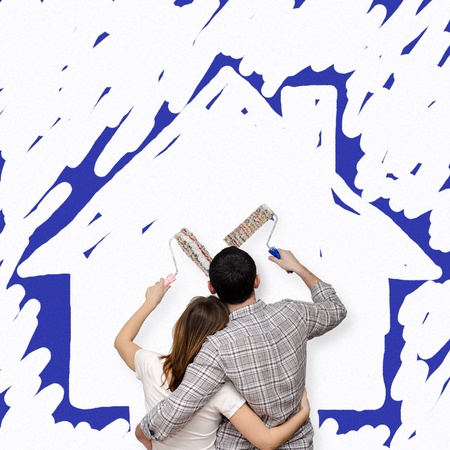 Young couple painting the future homeの写真素材
