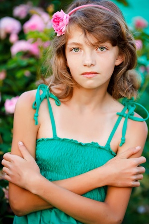 little girl in the field with flowersの写真素材