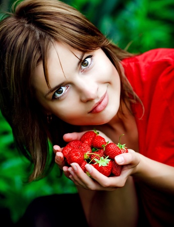 sweet strawberry in woman hands の写真素材