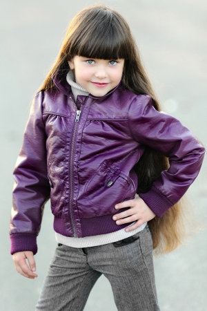 portrait of little girl outdoors in autumnの写真素材