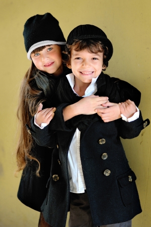 portrait of little boy and girl outdoors in autumnの写真素材