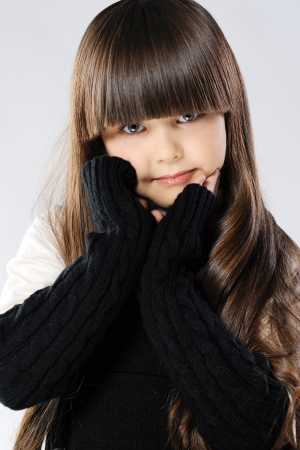 portrait of a stylish little girl in the studioの写真素材