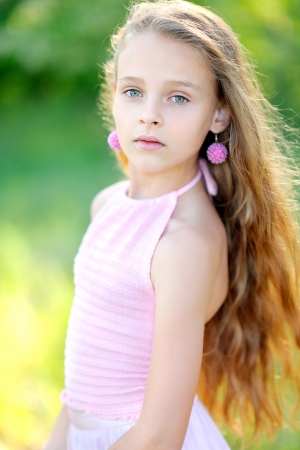 portrait of little girl outdoors in summerの写真素材