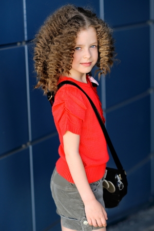 portrait of little girl outdoors iin the cityの写真素材