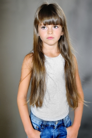 portrait of a beautiful little brunette girlの写真素材