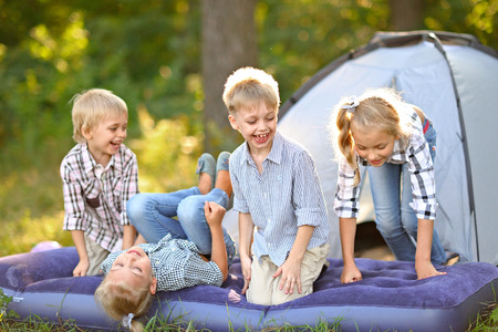 Portrait of young children on a camping holidayの写真素材