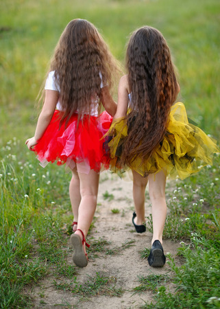 Portrait of two girls in the woods girlfriendsの写真素材