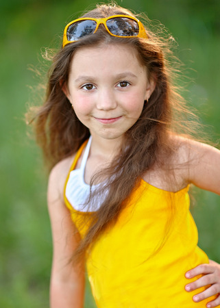 portrait of little girl outdoors in summerの写真素材