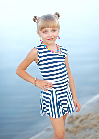 portrait of little girl on a summer beachの写真素材