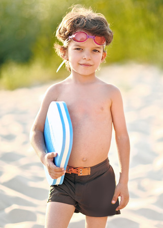 Portrait of a boy on the beach in summerの写真素材