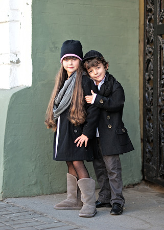 Portrait of a girl and boy in autumnの写真素材