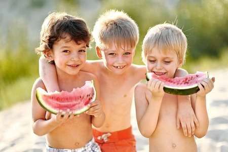 Portrait of a boy on the beach in summerの写真素材