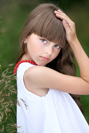 portrait of little girl outdoors in summerの写真素材