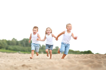 Portrait of children on the beach in summerの写真素材
