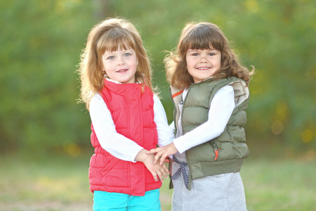 Portrait of two girls in the woods girlfriendsの写真素材