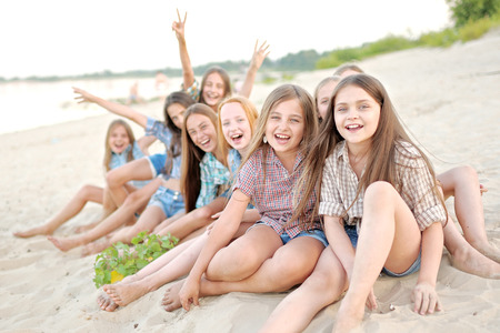 Portrait of joyful beautiful girlfriends on the natureの写真素材