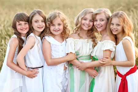 portrait of six little girls in cornfield fieldの写真素材