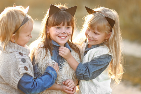 Portrait of three girls in the woods girlfriendsの写真素材
