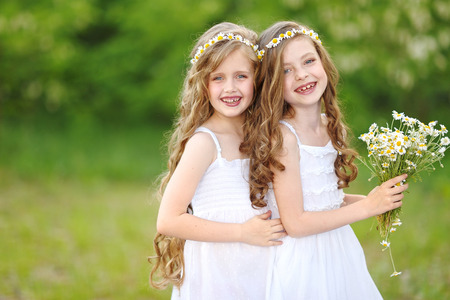 Portrait of two girls in the woods girlfriendsの写真素材