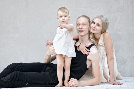 portrait of a happy family in the summer on the nature