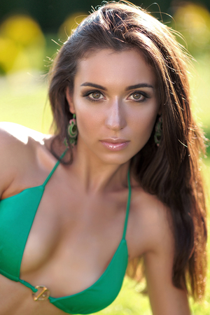 portrait of a beautiful young girl in a swimsuitの写真素材