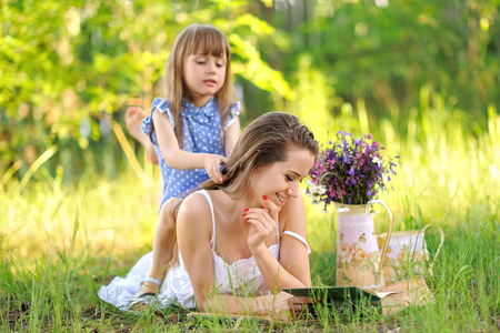 portrait of a happy family in the summer on the nature