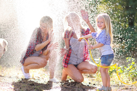 portrait of a happy family in the summer on the natureの写真素材