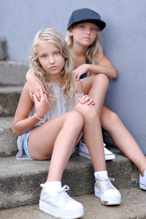 portrait of two girls of girlfriends on a summer natureの写真素材
